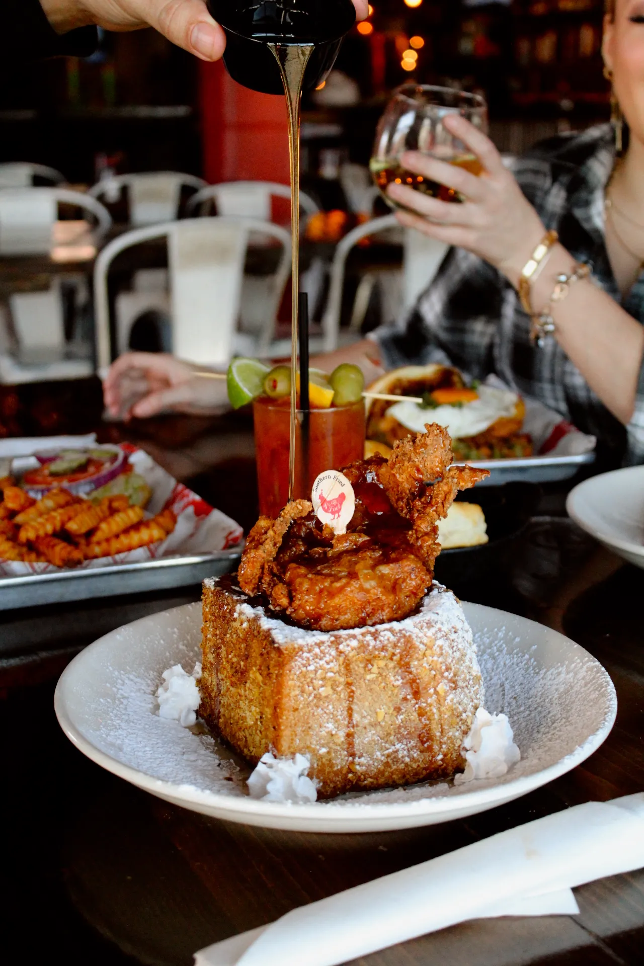 Stuffed French Toast A plate of stuffed French toast topped with fried chicken